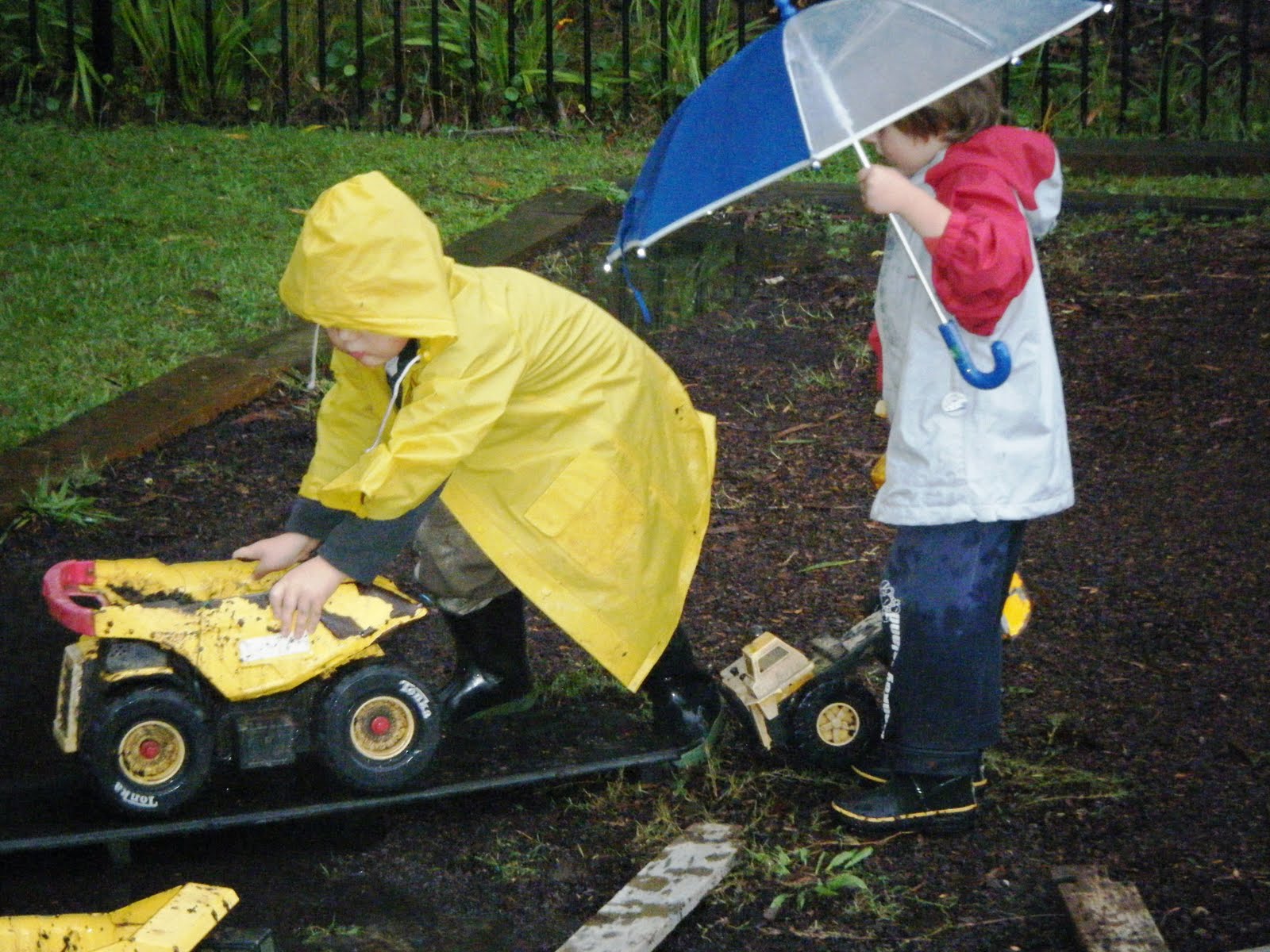 Children Playing In Rain