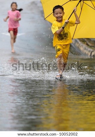 Children Playing In Rain Clipart