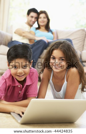 Children Reading Books With Parents