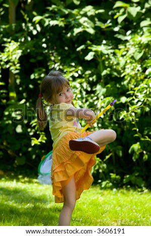 Little Children Playing In The Park Catching Butterflies