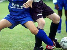 Children Playing Football At School