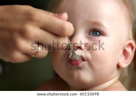 Feeding Baby Milk From A Cup