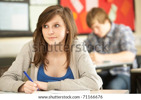 Students Studying In Classroom