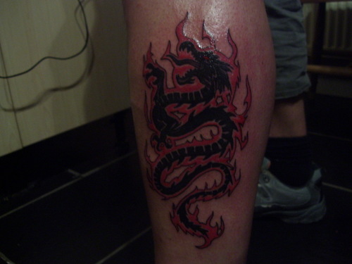 Tribal Dragon Tattoo On Leg