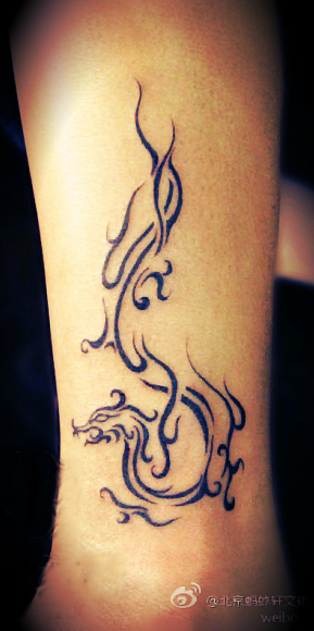 Tribal Dragon Tattoo On Leg